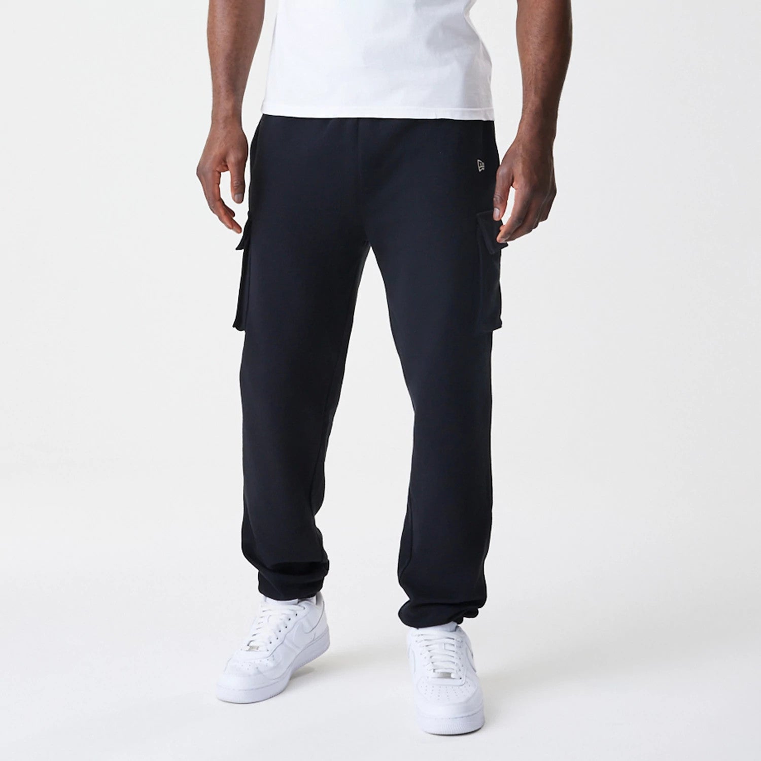The Male model is wearing New Era Cargo Black Joggers 3