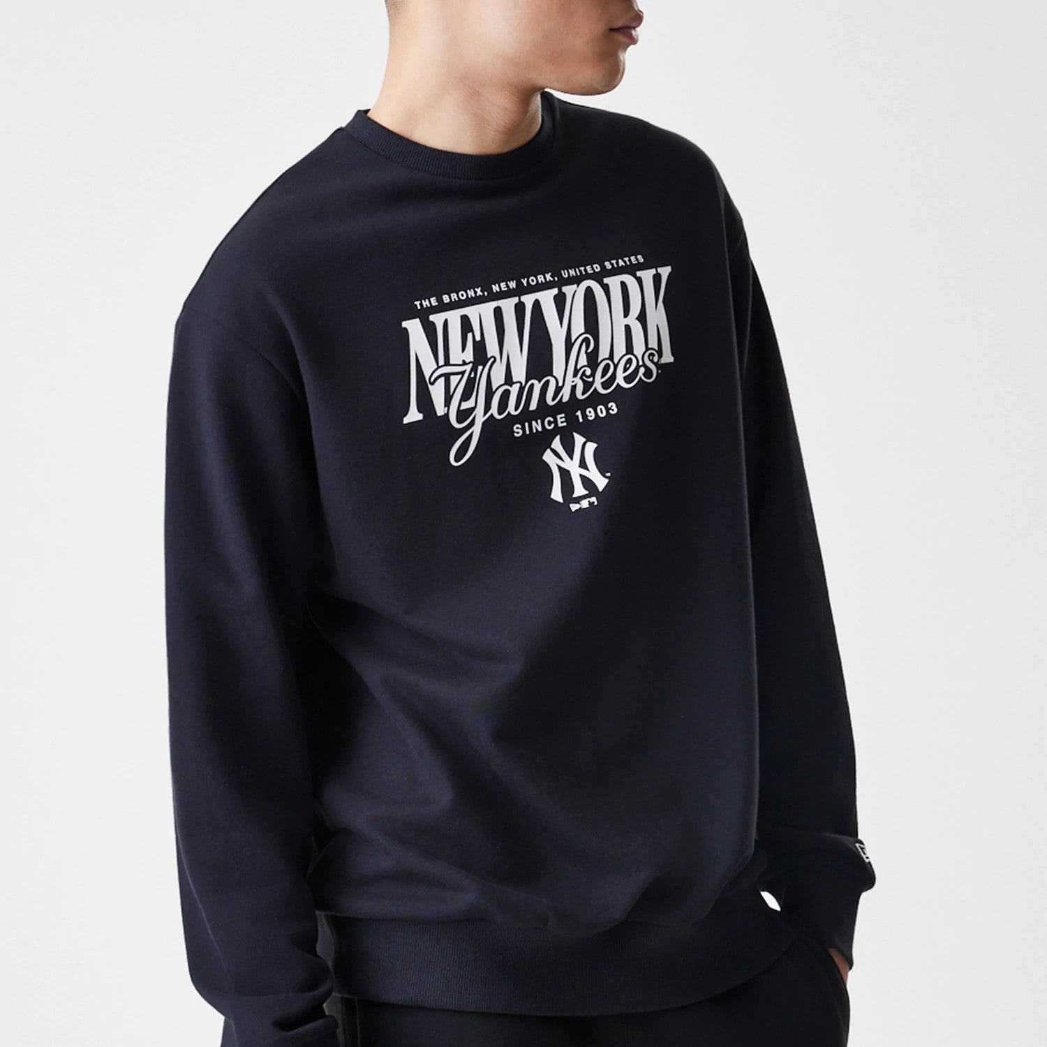 The Male model is wearing New York Yankees MLB Script Black Crew Neck Sweater 3