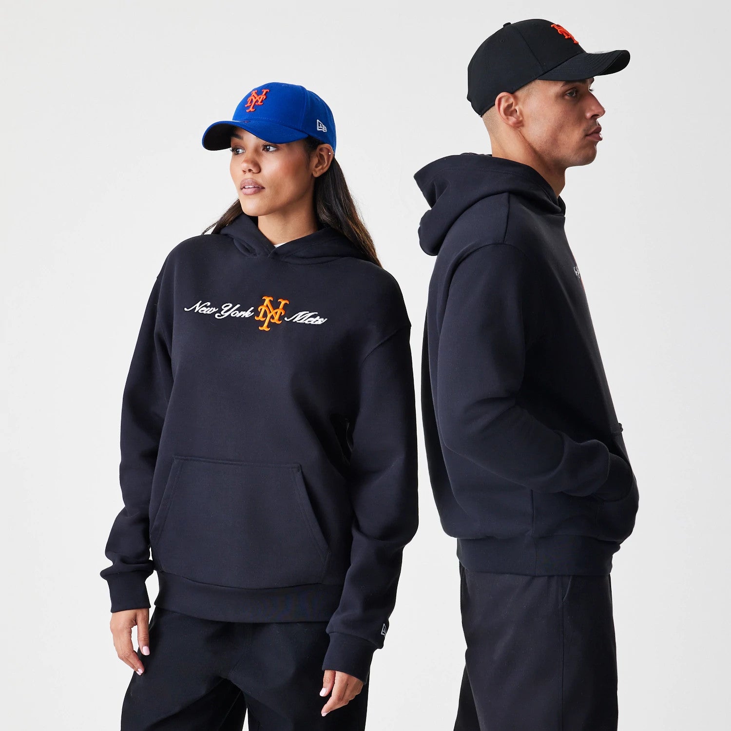 The Male model is wearing New York Mets MLB Script Black Oversized Pullover Hoodie 1