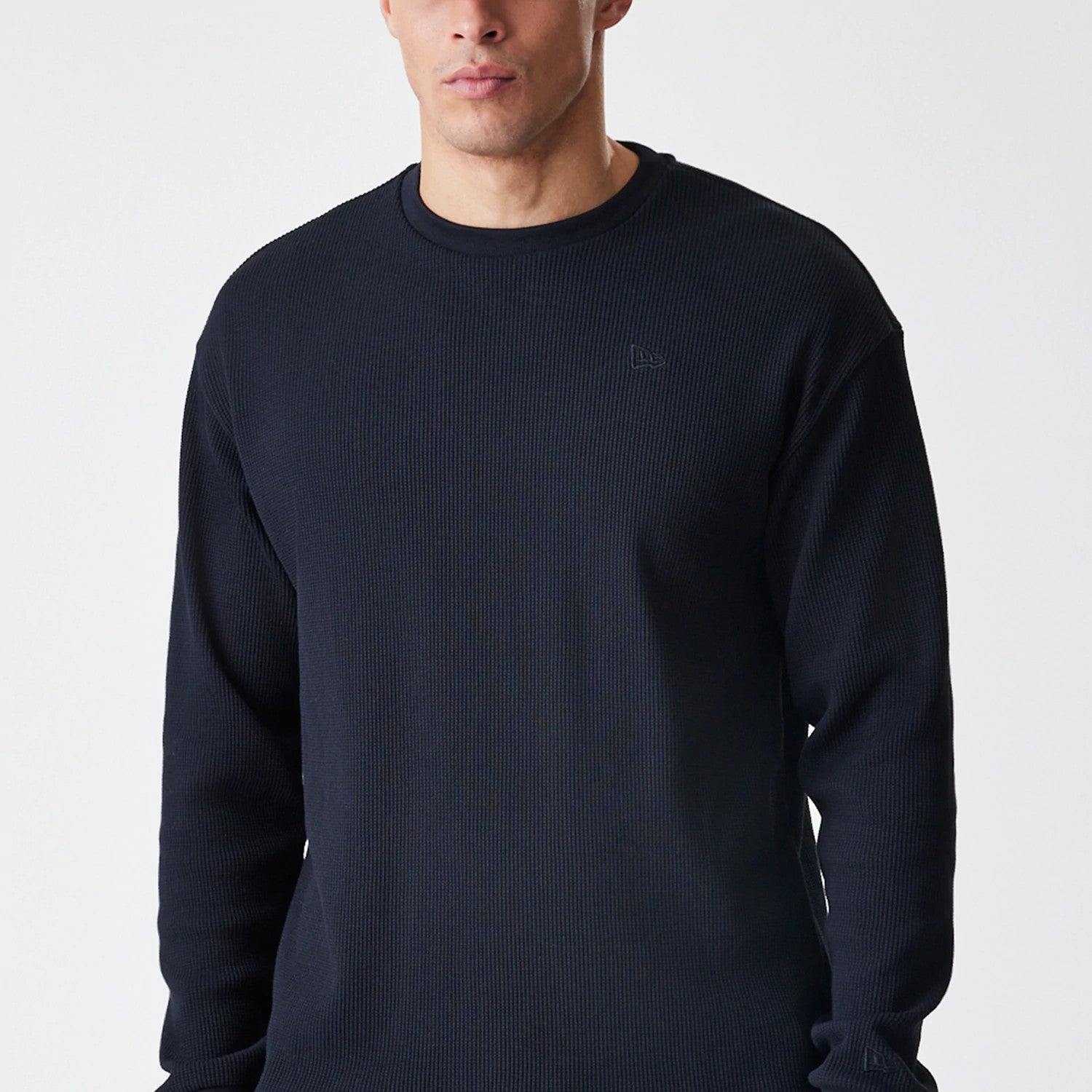 The Male model is wearing New Era Waffle Black Long Sleeve T-Shirt 3