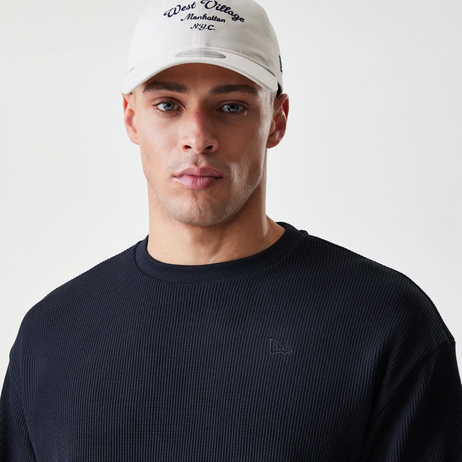 The Male model is wearing New Era Waffle Black Long Sleeve T-Shirt 4