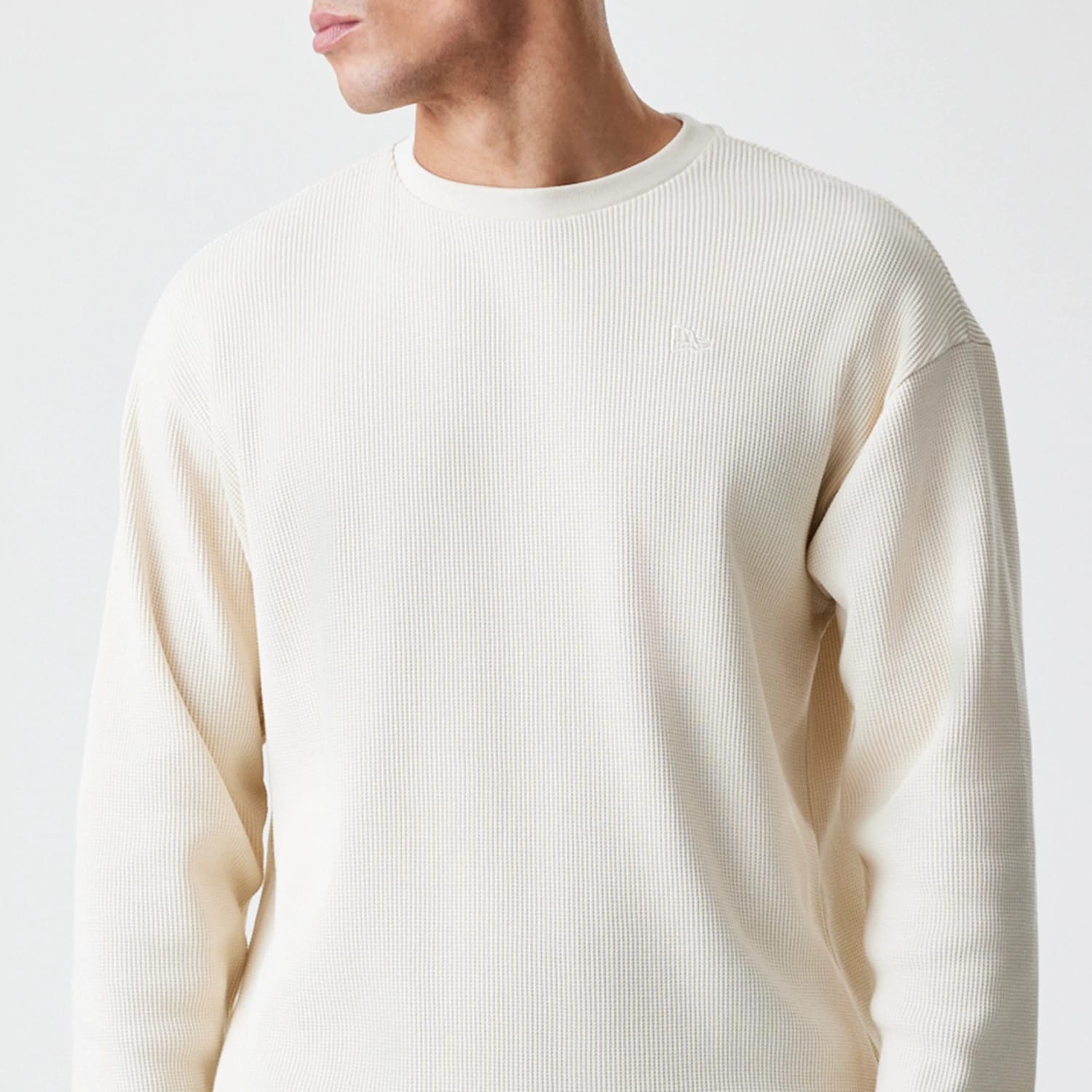 The Male model is wearing New Era Waffle Light Beige Long Sleeve T-Shirt 3