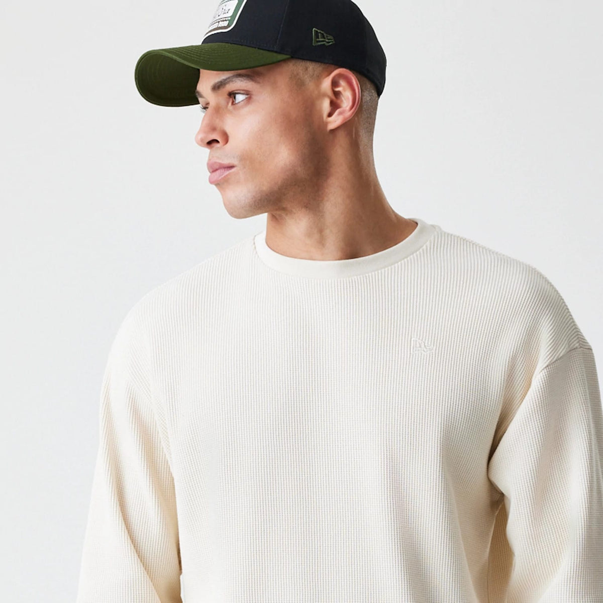 The Male model is wearing New Era Waffle Light Beige Long Sleeve T-Shirt 4