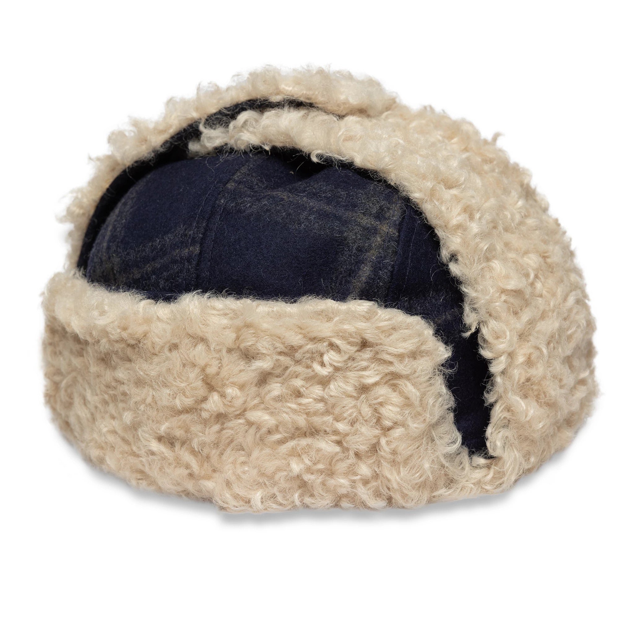 New Era Loden Navy Trapper Hat, rear view showing the navy wool crown partially covered by beige fluffy faux fur lining, with the ear flaps secured upwards on the structured design.