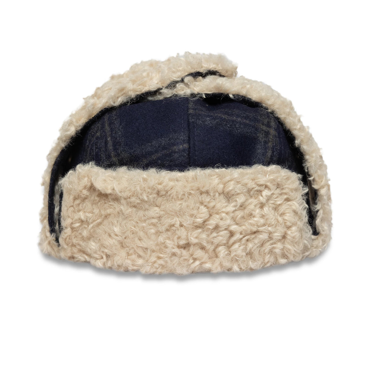 New Era Loden Navy Trapper Hat, rear view showing the thick cream shearling trim folded up at the back with the textured navy crown partially underneath, featuring ear flaps on either side.