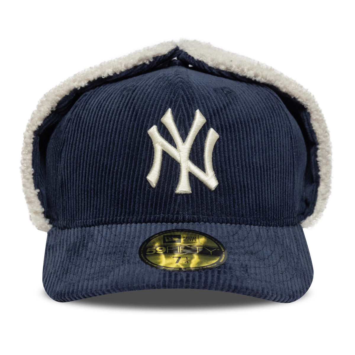 New York Yankees MLB Cord Navy Dogear New Era 59FIFTY Fitted Cap, front view showing the white embroidered NY logo on the structured navy cord crown with cream lining on the dogear flaps, and a gold 59FIFTY size sticker on the flat visor.