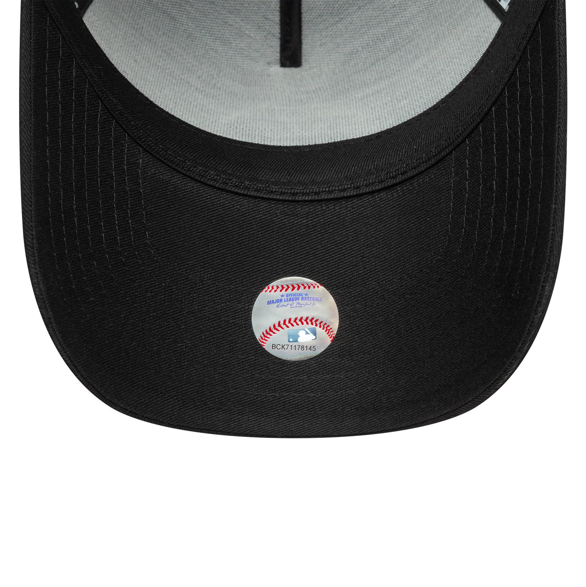 New York Yankees MLB Team Outline Black New Era 9FORTY E-Frame Adjustable Cap, inside view showing a grey undervisor with a MLB logo sticker, black taping along the panels, and a black sweatband.