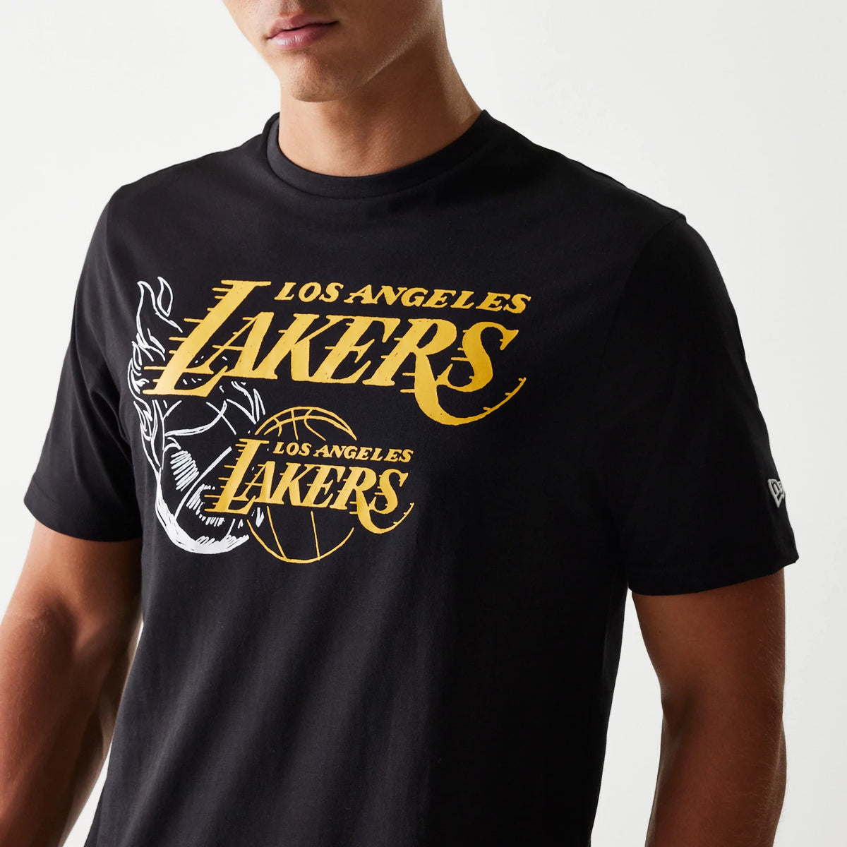 New Era LA Lakers NBA Flame Graphic Black T-Shirt, front view showing the yellow LA Lakers lettering and flame graphic design on the chest, with a small embroidered New Era logo on the left sleeve.
