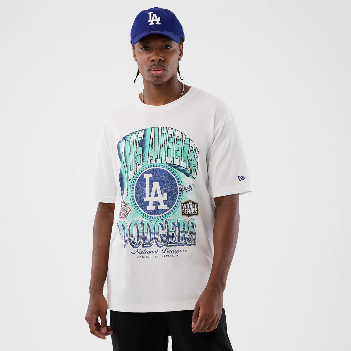 New Era LA Dodgers MLB Sport Script Classic White T-Shirt, front view on-model with a blue and green Los Angeles graphic prominently displayed, the LA logo in the centre, and an embroidered New Era logo on the left sleeve.