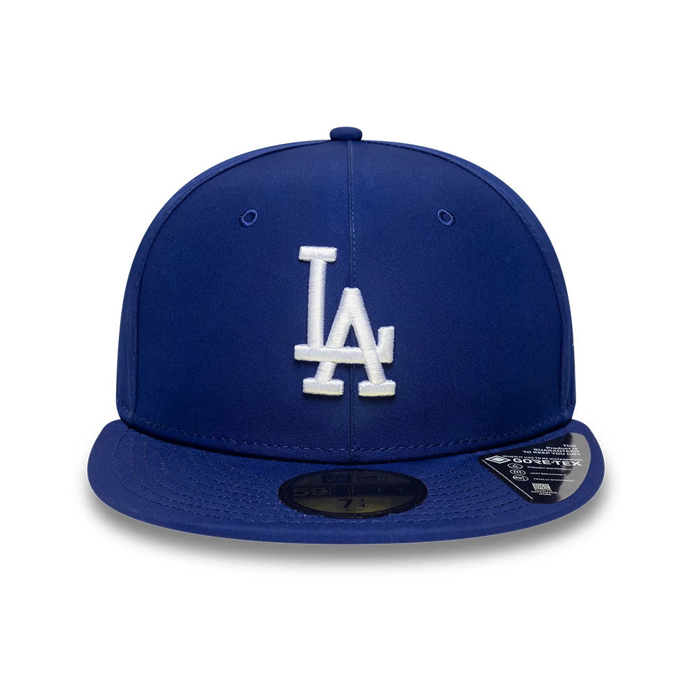 LA Dodgers MLB Gore-Tex Dark Blue New Era 59FIFTY Fitted Cap, front view showing a raised white embroidered LA logo on the structured dark blue crown, with a dark blue visor and a gold 59FIFTY size sticker on top.