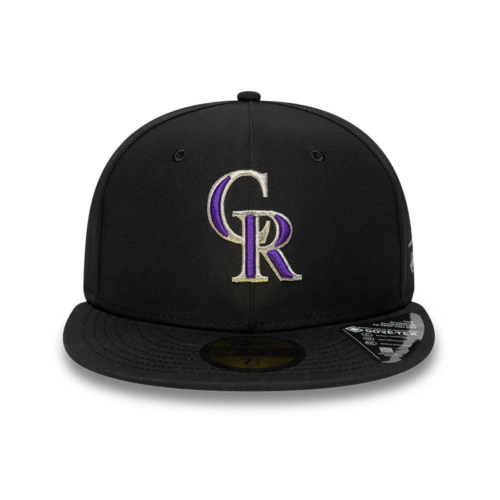 Colorado Rockies MLB Gore-Tex Black New Era 59FIFTY Fitted Cap, front view showing the raised purple and white embroidered CR logo on the structured black crown, with a flat black visor and gold 59FIFTY size sticker on the visor.