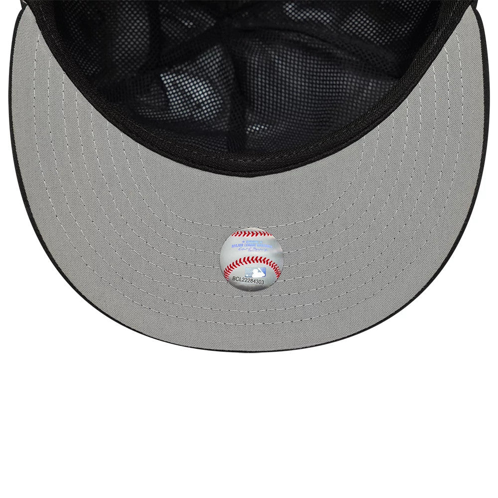 Colorado Rockies MLB Gore-Tex Black New Era 59FIFTY Fitted Cap, inside view showing the grey undervisor with a baseball graphic sticker, black mesh lining, and detailed stitching on the visor edge.