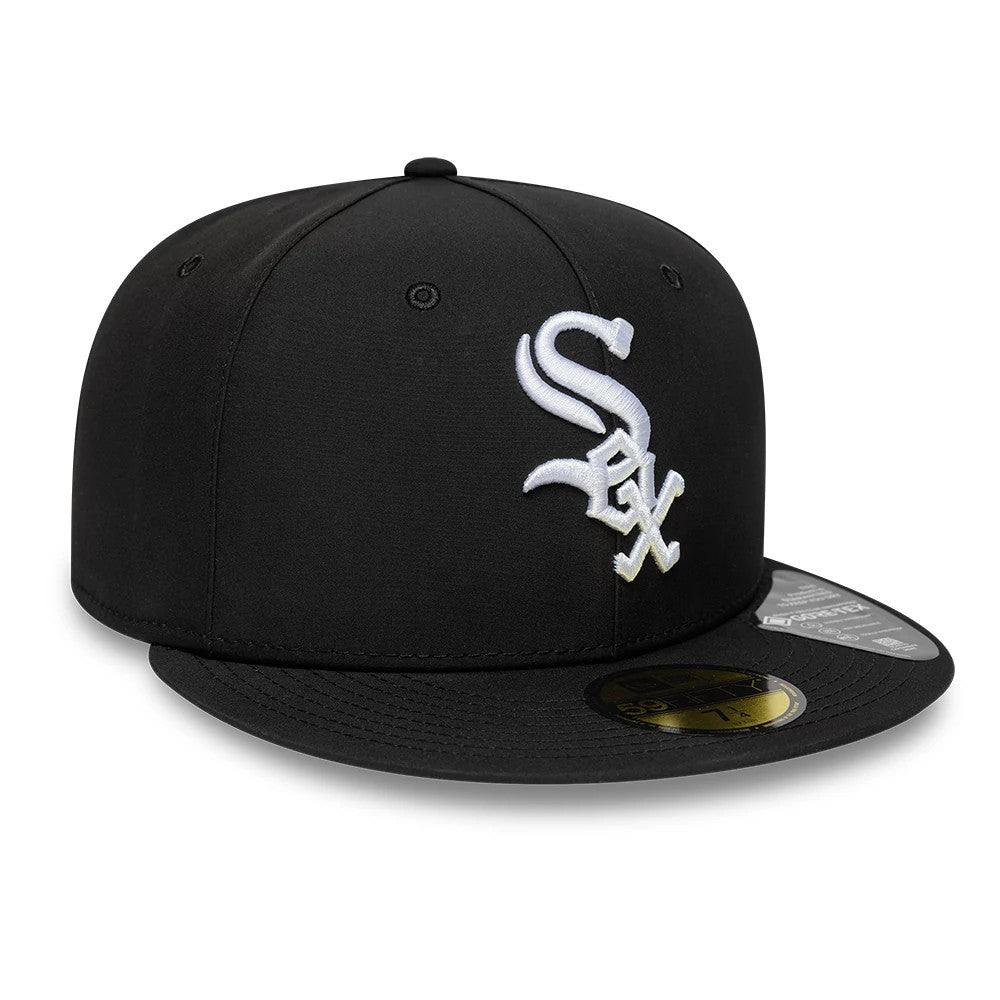 Chicago White Sox MLB Gore-Tex Black New Era 59FIFTY Fitted Cap, three-quarter view showing the raised white Sox logo embroidered on the front panel, a flat black visor with a gold 59FIFTY size sticker, and the New Era flag logo on the left side.