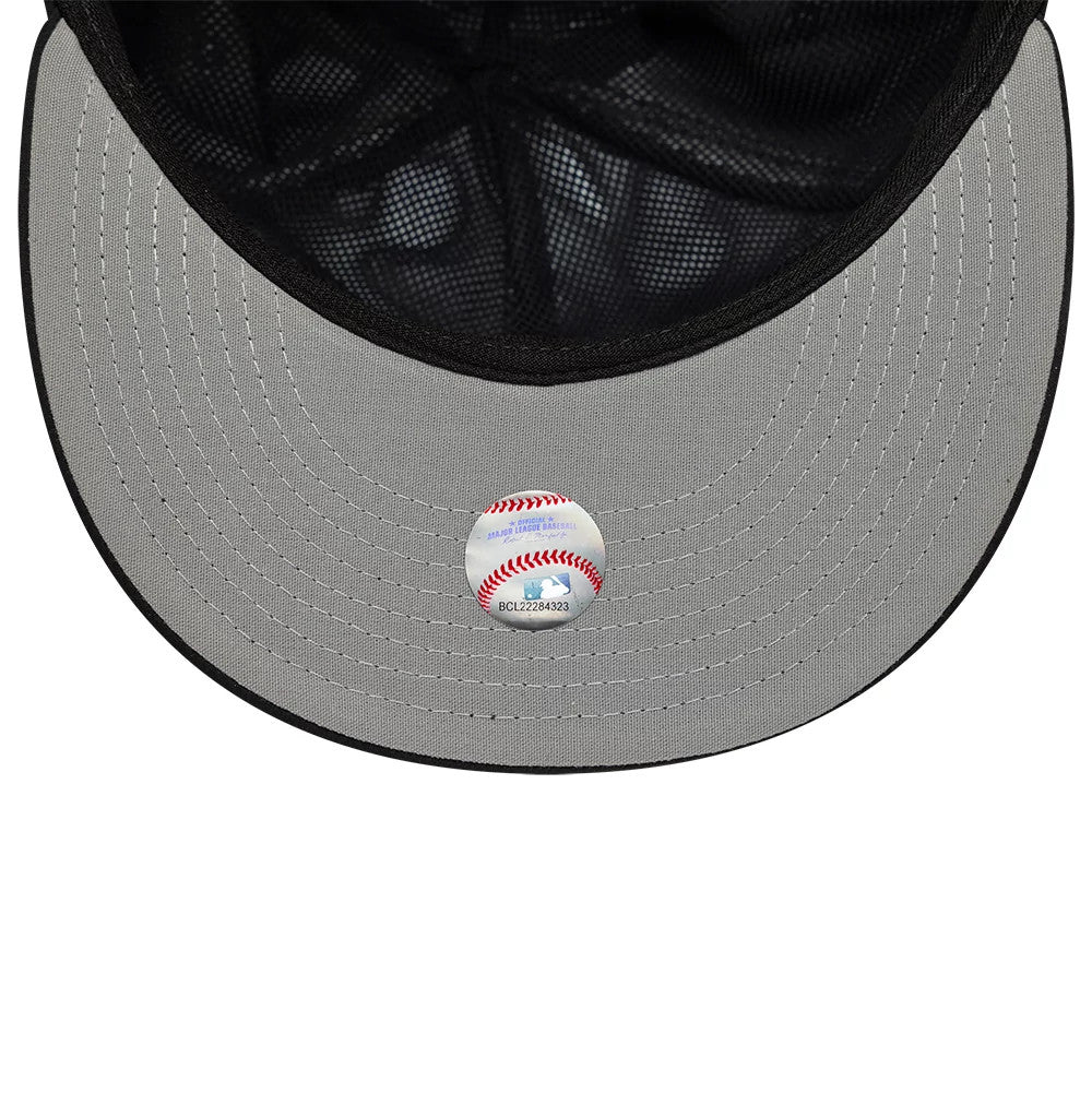 Chicago White Sox MLB Gore-Tex Black New Era 59FIFTY Fitted Cap, inside view showing a grey undervisor with detailed stitching and a baseball-themed sticker along with black taping on the mesh interior.