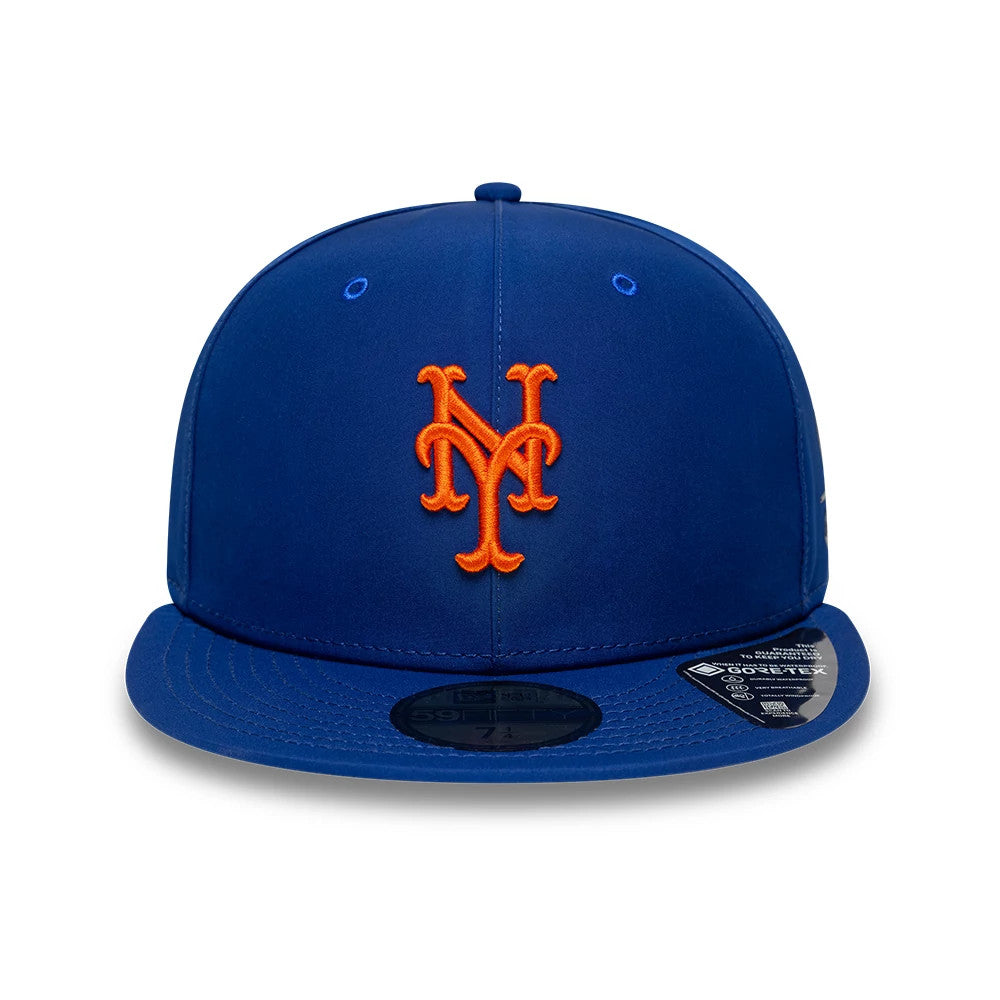 New York Mets MLB Gore-Tex Blue New Era 59FIFTY Fitted Cap, front view showing raised orange embroidered NY Mets logo on the structured blue crown, with dark blue visor and black 59FIFTY size sticker.