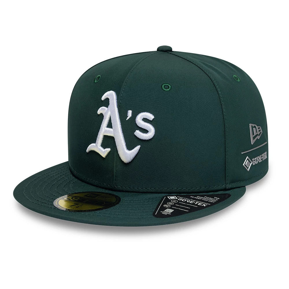 Athletics MLB Gore-Tex Dark Green New Era 59FIFTY Fitted Cap, front view showing the white raised embroidered A's logo on the structured dark green crown, flat visor with gold 59FIFTY size sticker and Gore-Tex badge on the right side.
