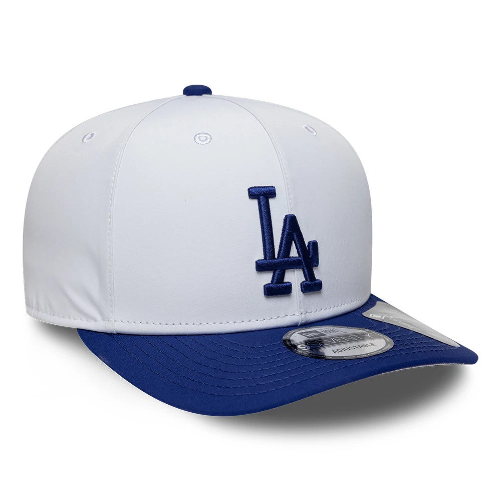 LA Dodgers MLB Gore-Tex White New Era 9SEVENTY Stretch Snap Adjustable Cap, three-quarter view showing the blue raised LA logo on the front panel, royal blue visor, and 9SEVENTY size sticker on the visor.