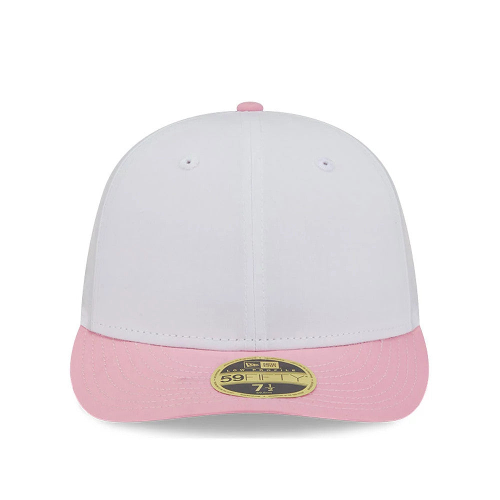 New Era Open White & Pink Low Profile 59FIFTY Fitted Cap, front view showing a clean white crown with matching eyelets and a top button, a pink visor with a gold 59FIFTY size sticker and a white undervisor hint.