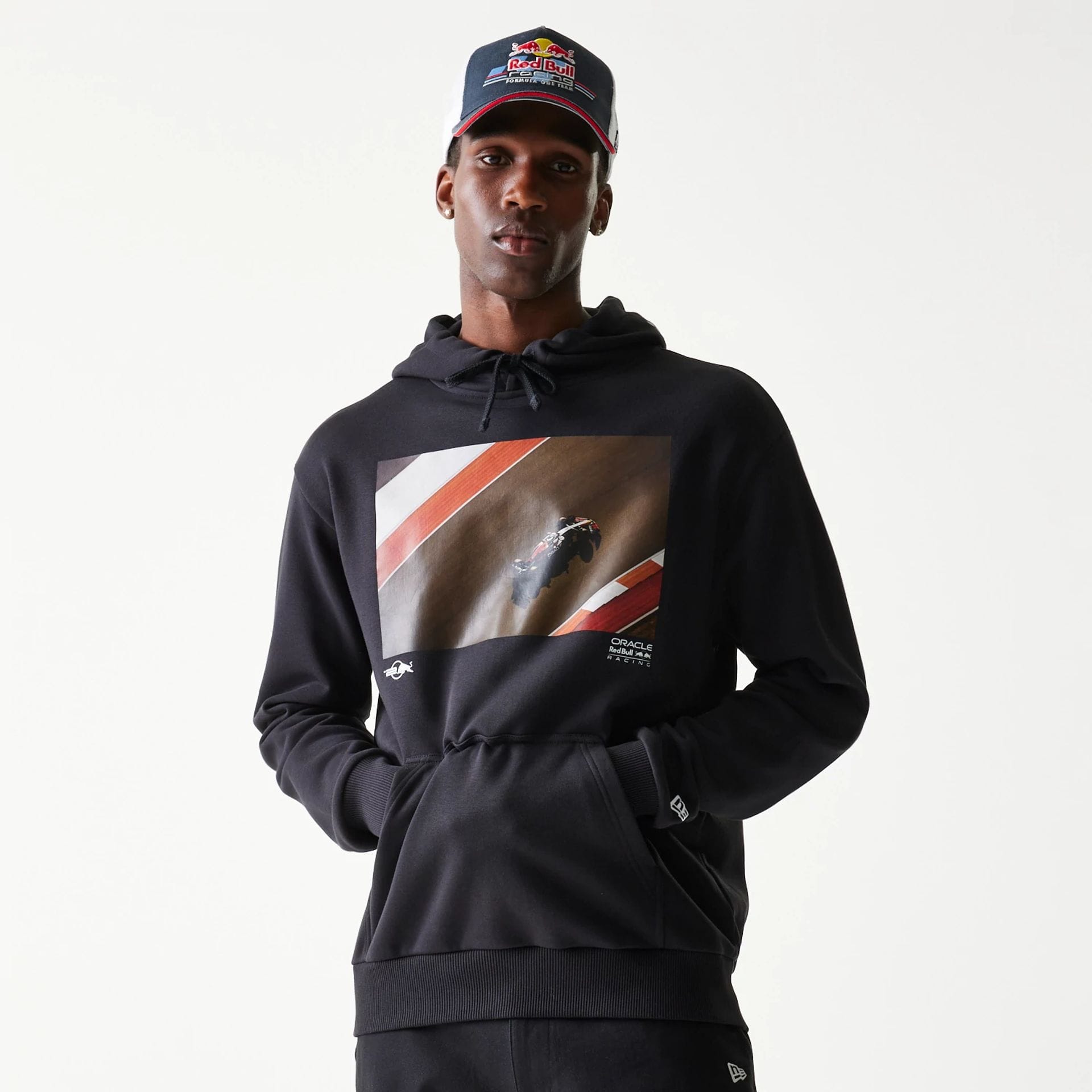 The Male model is wearing Red Bull Racing Black Oversized Pullover Hoodie 1