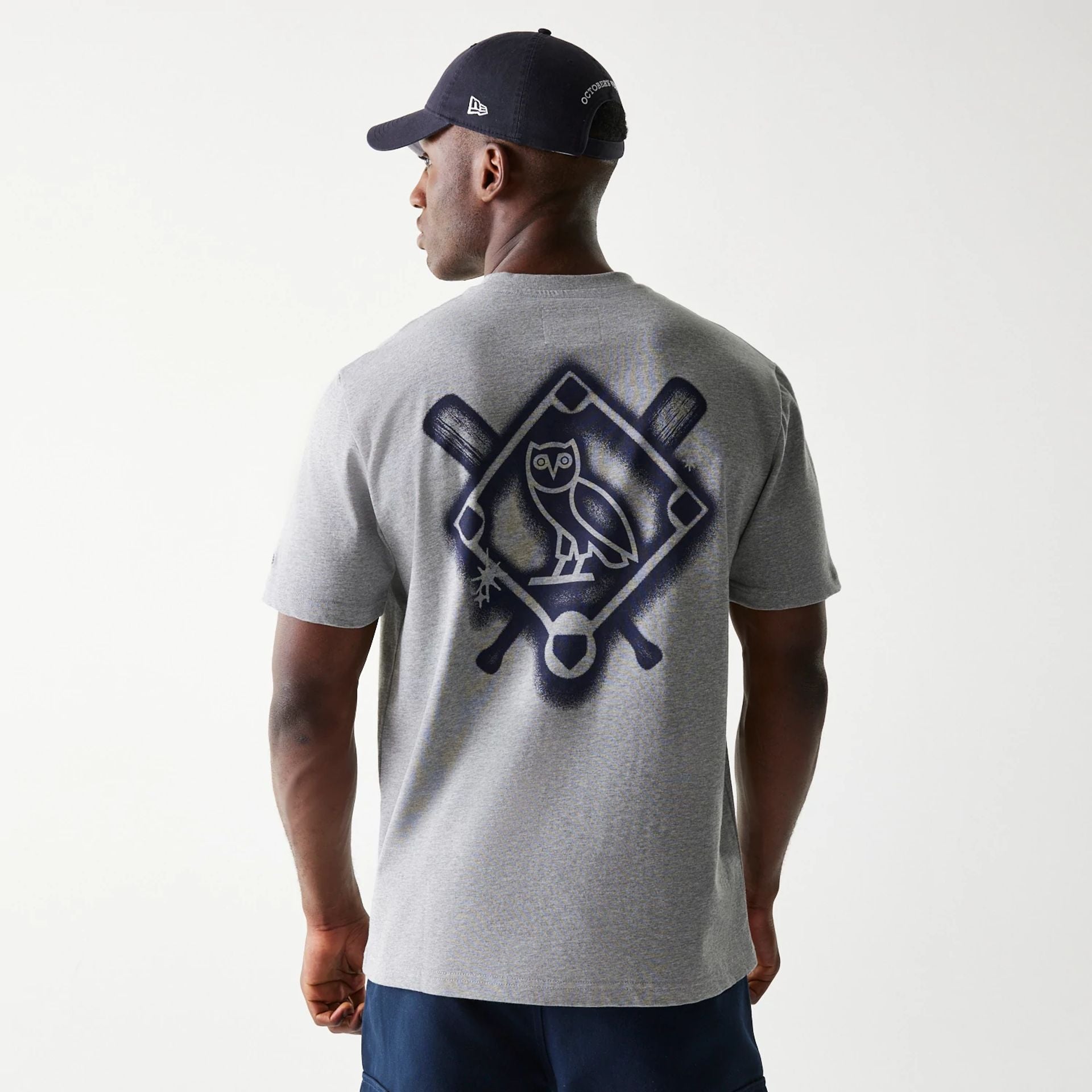 The Male model is wearing New York Yankees OVO x MLB Grey T-Shirt 2