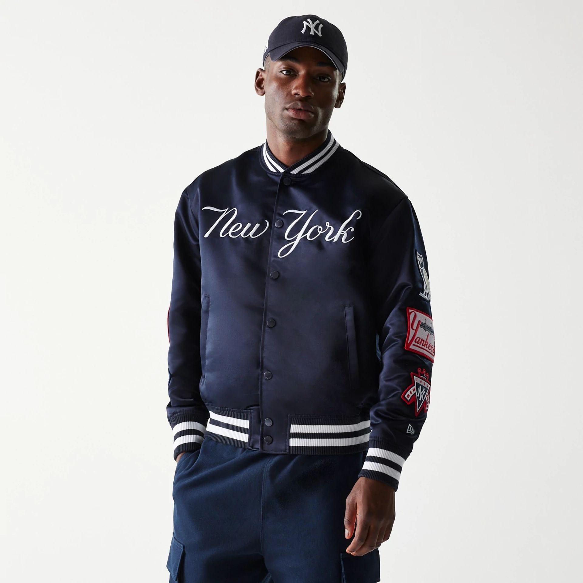 The Male model is wearing New York Yankees OVO x MLB Navy Jacket 1