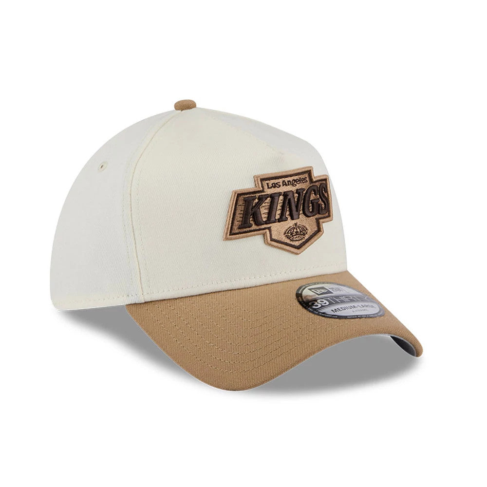 LA Kings NHL Sandy Bay White New Era 39THIRTY A-Frame Stretch Fit Cap, three-quarter view showing raised beige embroidered Kings logo on the front panel, contrasting brown visor and brown top button, with 39THIRTY size sticker on the visor.
