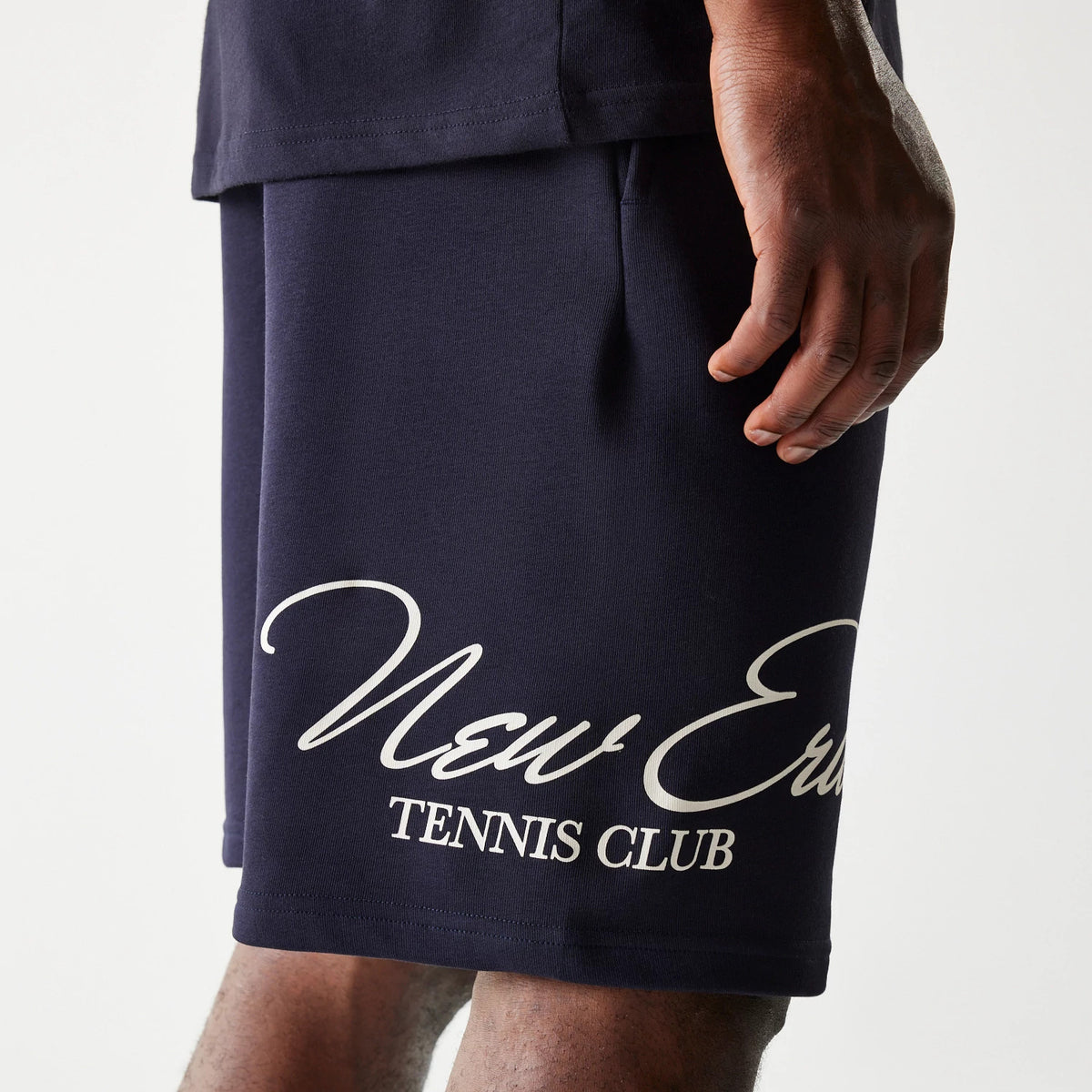 The Male model is wearing New Era Side Logo Navy Shorts 4