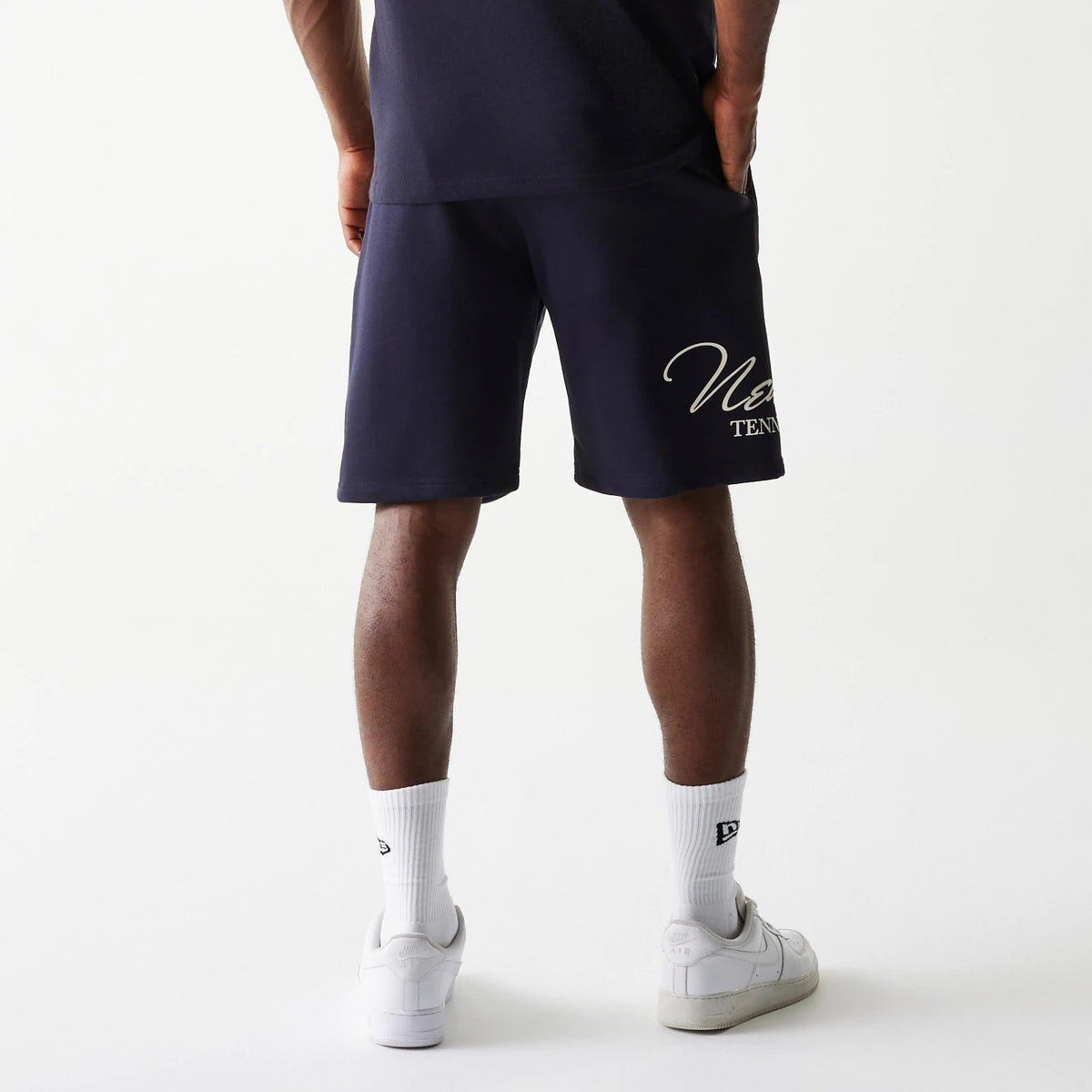 The Male model is wearing New Era Side Logo Navy Shorts 2