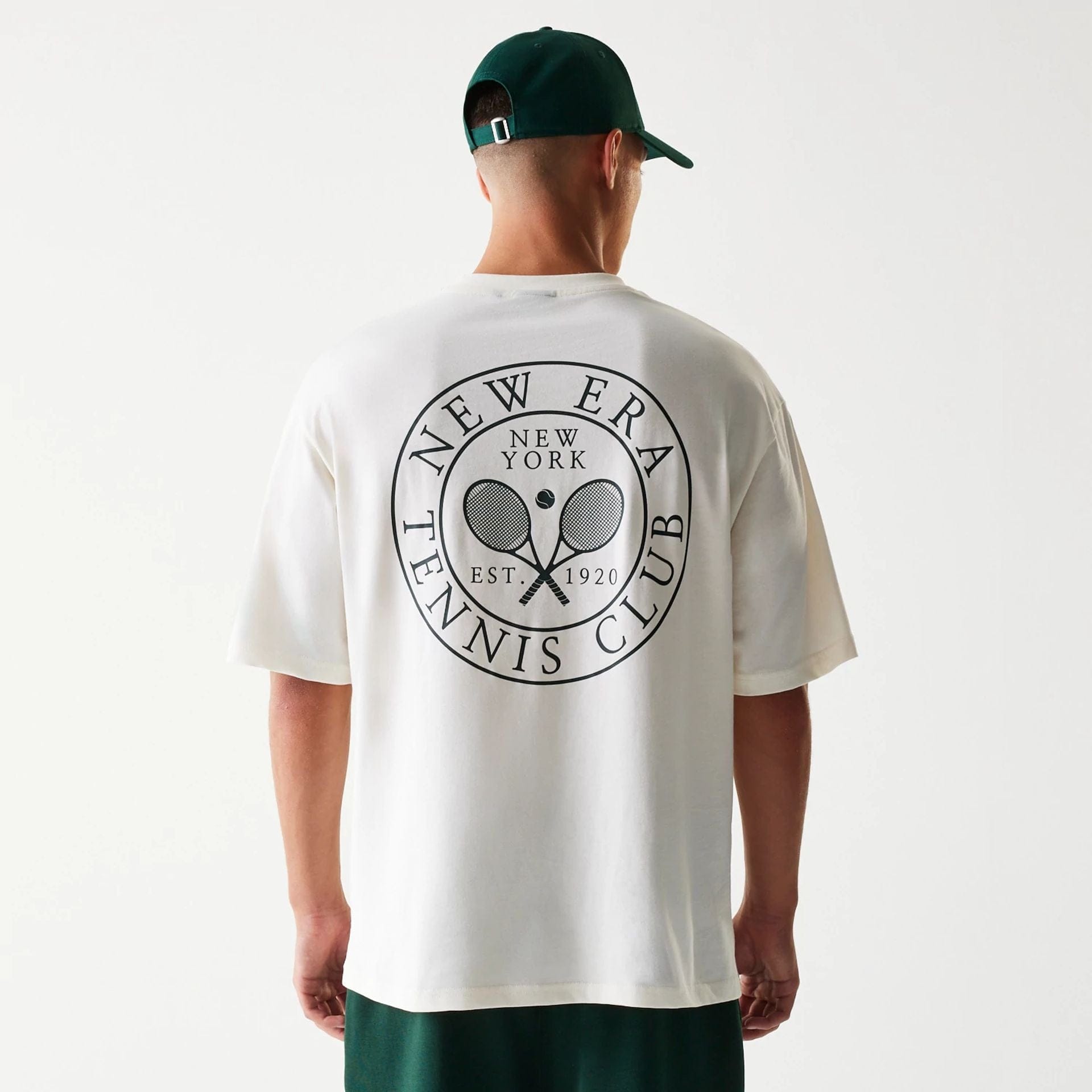 The Male model is wearing New Era Open White Oversized T-Shirt 2