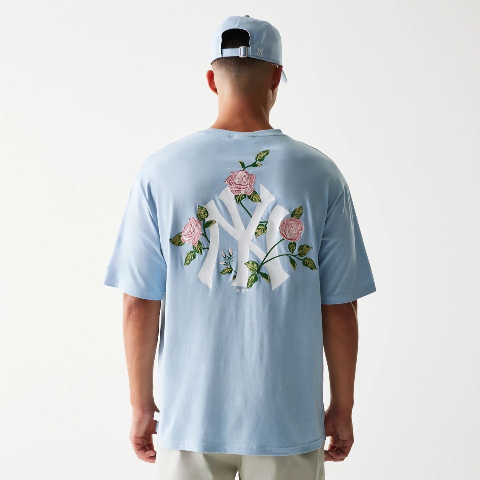 The Male model is wearing New York Yankees MLB Floral Pastel Blue Oversized T-Shirt 2