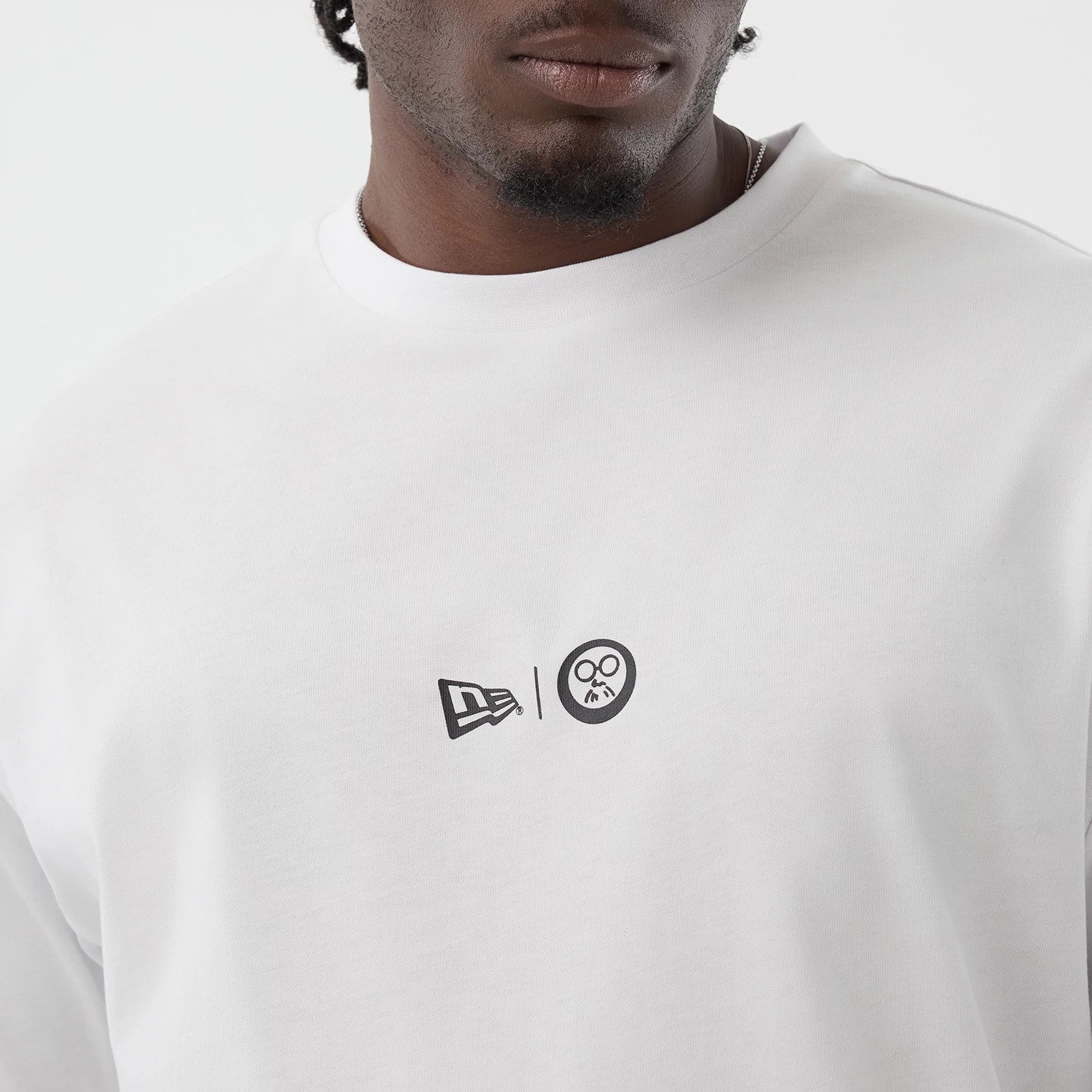 The Male model is wearing Sakamoto Days Icon Netflix White T-Shirt 4