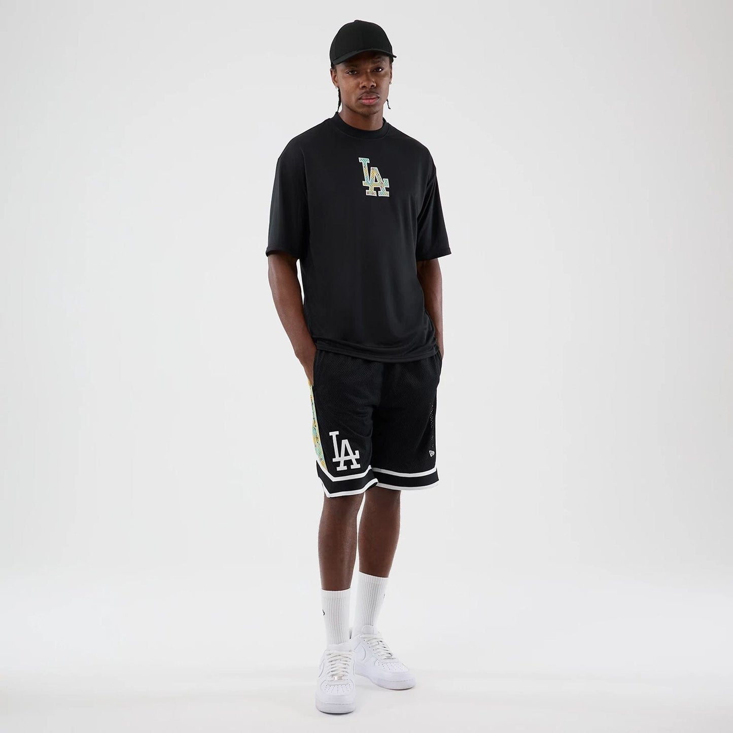 The Male model is wearing LA Dodgers MLB Mesh Black Mesh Shorts 8