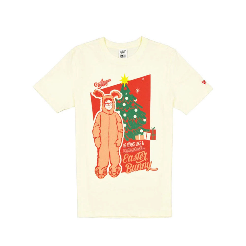 New Era A Christmas Story Easter Bunny Cream T-Shirt, front view showing a large festive graphic with a character in a bunny costume next to a decorated Christmas tree and gifts, with red lettering that reads He looks like a deranged Easter Bunny.