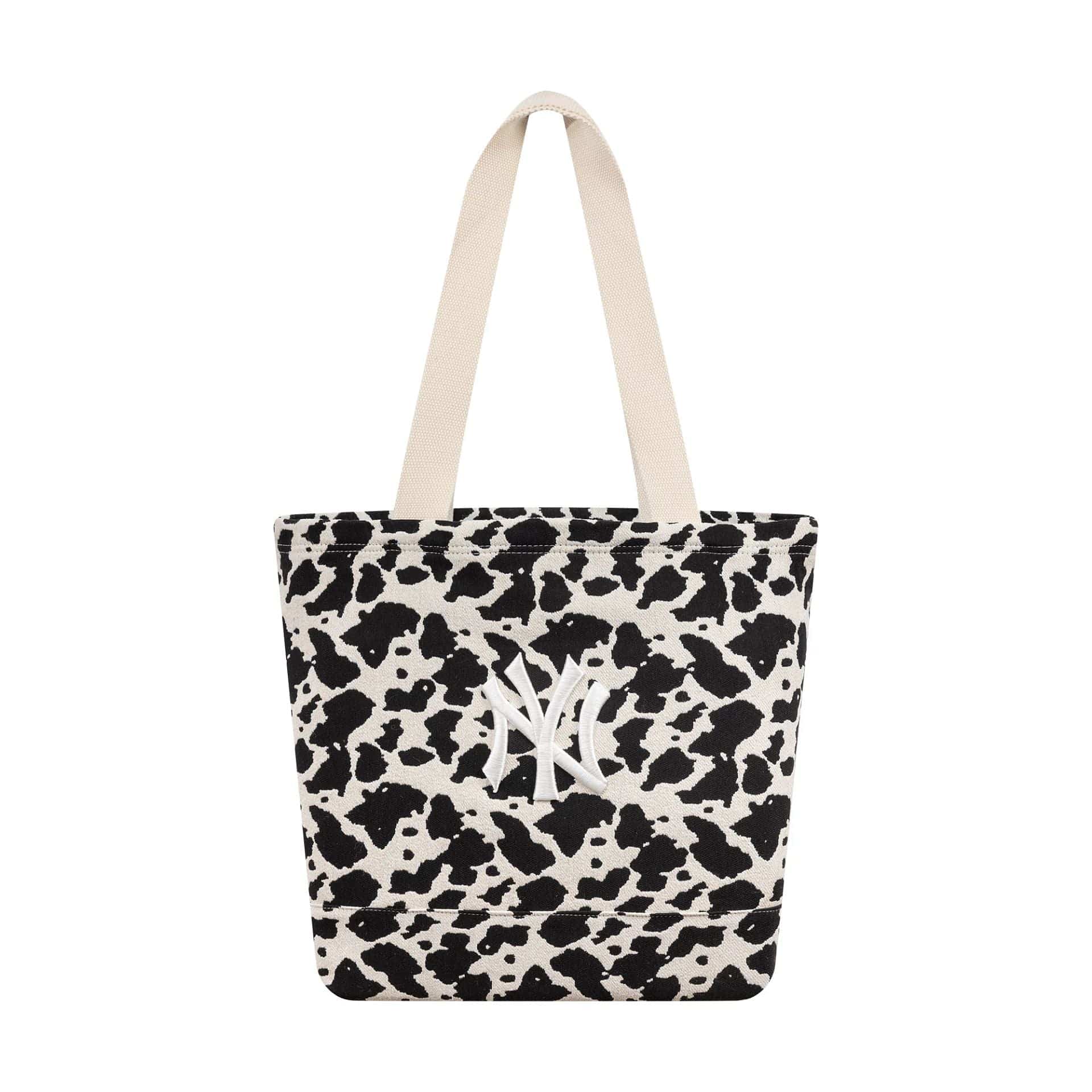 Pictured is this MLB Cow Jacquard New York Yankees Tote Bag in cream. 1