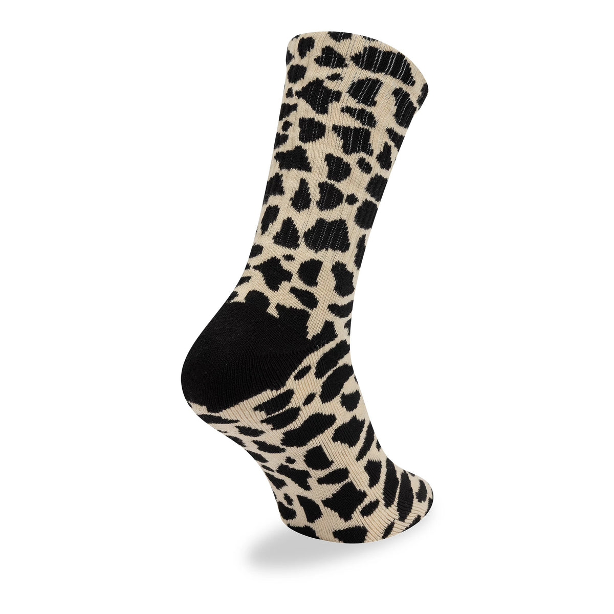 New Era New York Yankees MLB Cow Black Crew Socks, three-quarter view showing the distinctive black and cream cow pattern covering the entire sock, with a black toe and heel for contrast.