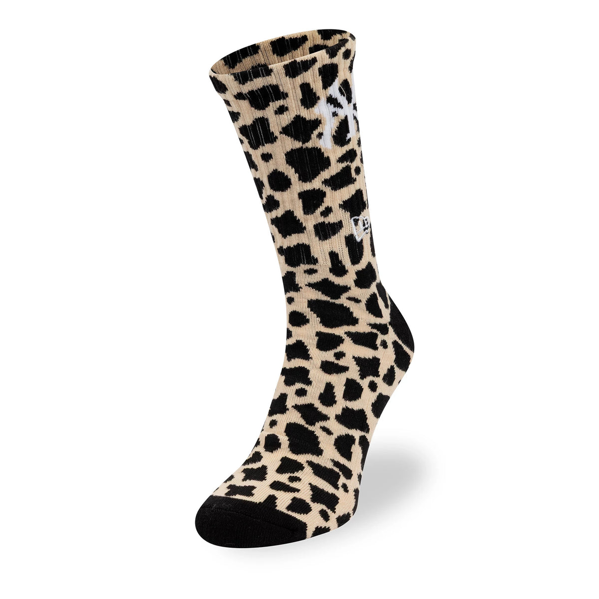 New Era New York Yankees MLB Cow Black Crew Socks, front view showcasing a beige and black cow print pattern with a white embroidered New Era logo on the side and contrasting black heel and toe sections.
