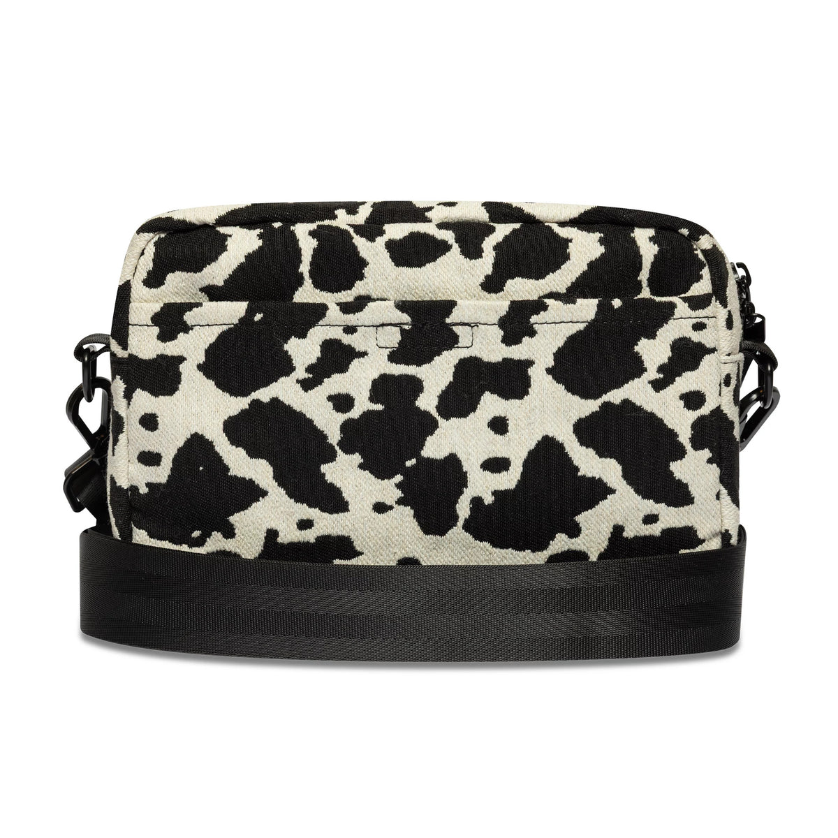New Era Cow Jacquard Light Beige Waist Bag, front view showing a light beige and black cow print pattern across the rectangular shape, with a black zip closure along the top and an attached adjustable black strap at the sides.