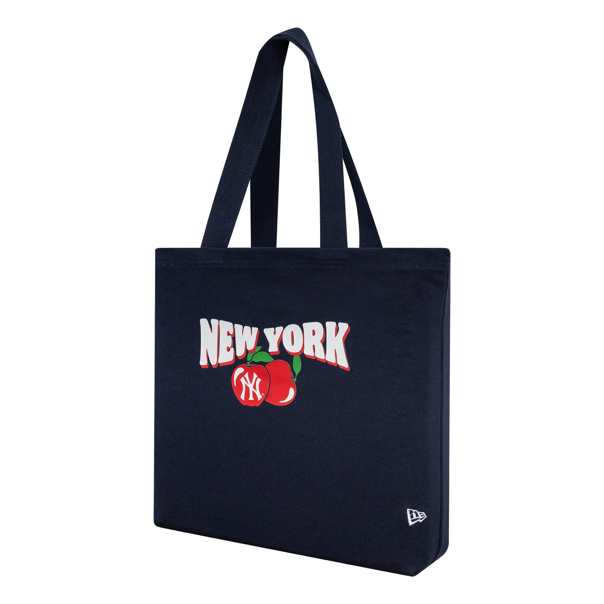 New Era New York Yankees MLB Fruit Navy Tote Bag, three-quarter view displaying the white New York lettering above a red apple graphic with the NY logo, and an embroidered New Era logo near the bottom corner.