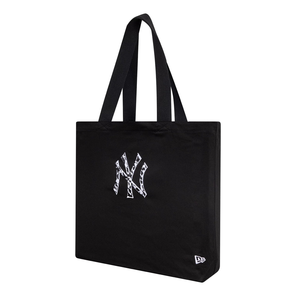 New Era New York Yankees MLB Animal Infill Black Tote Bag, three-quarter view showing the white embroidered yankees logo with animal pattern infill on the front, accompanied by two black handles.