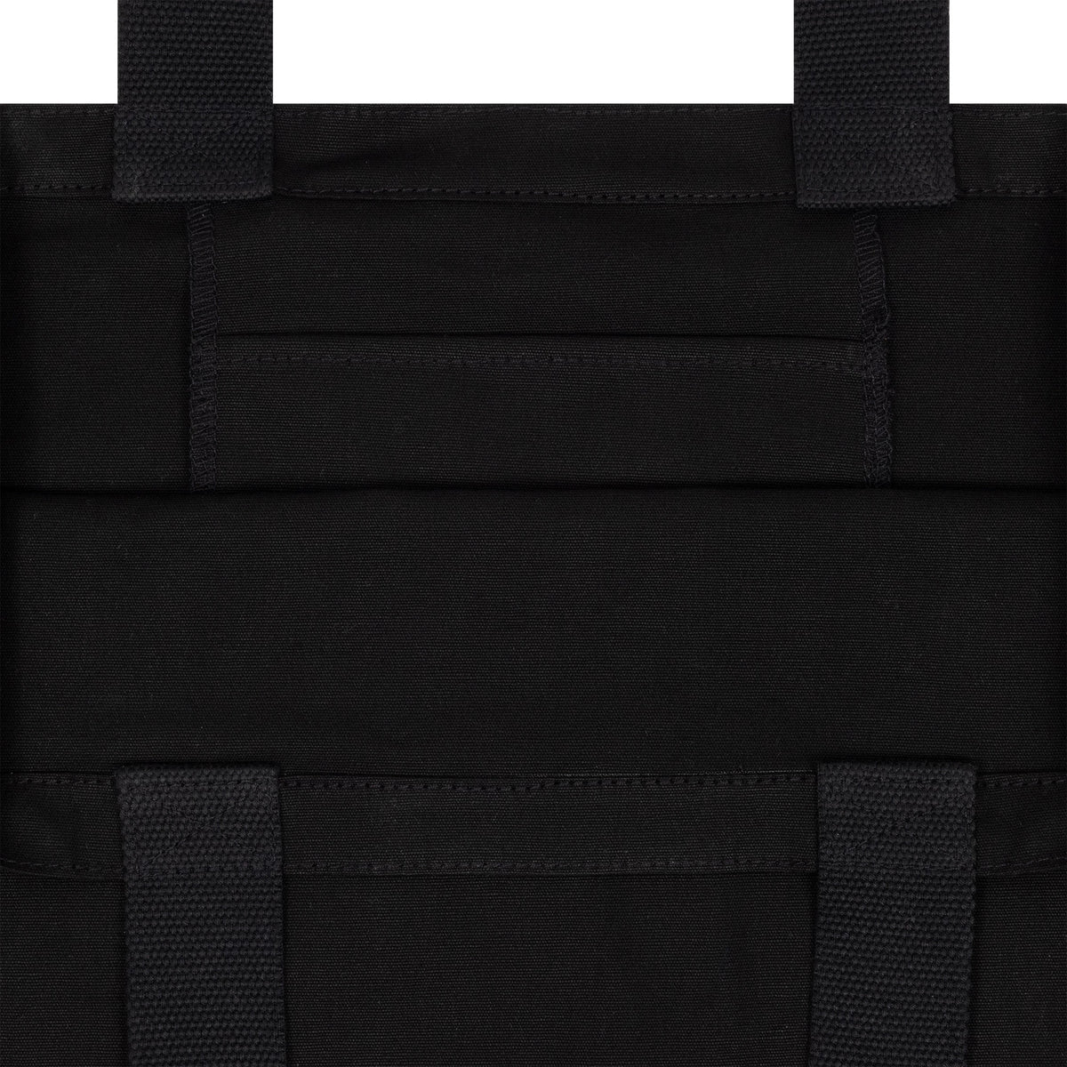 New Era New York Yankees MLB Animal Infill Black Tote Bag, front view showing black structured fabric with reinforced stitching, double straps emerging from the top, and a rectangular pocket sewn into the centre panel.