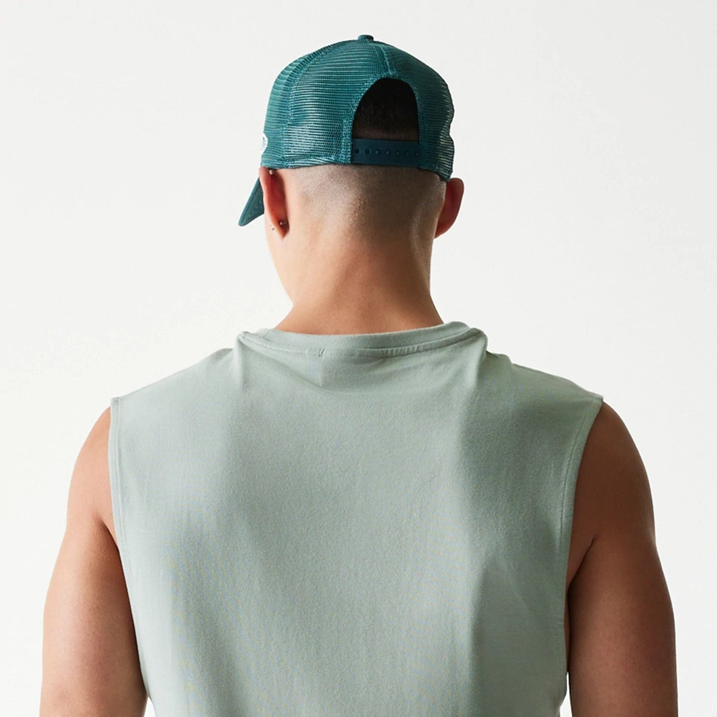 The model is wearing this MLB League Essential LA Dodgers Sleeveless T-Shirt in pastel green. 8