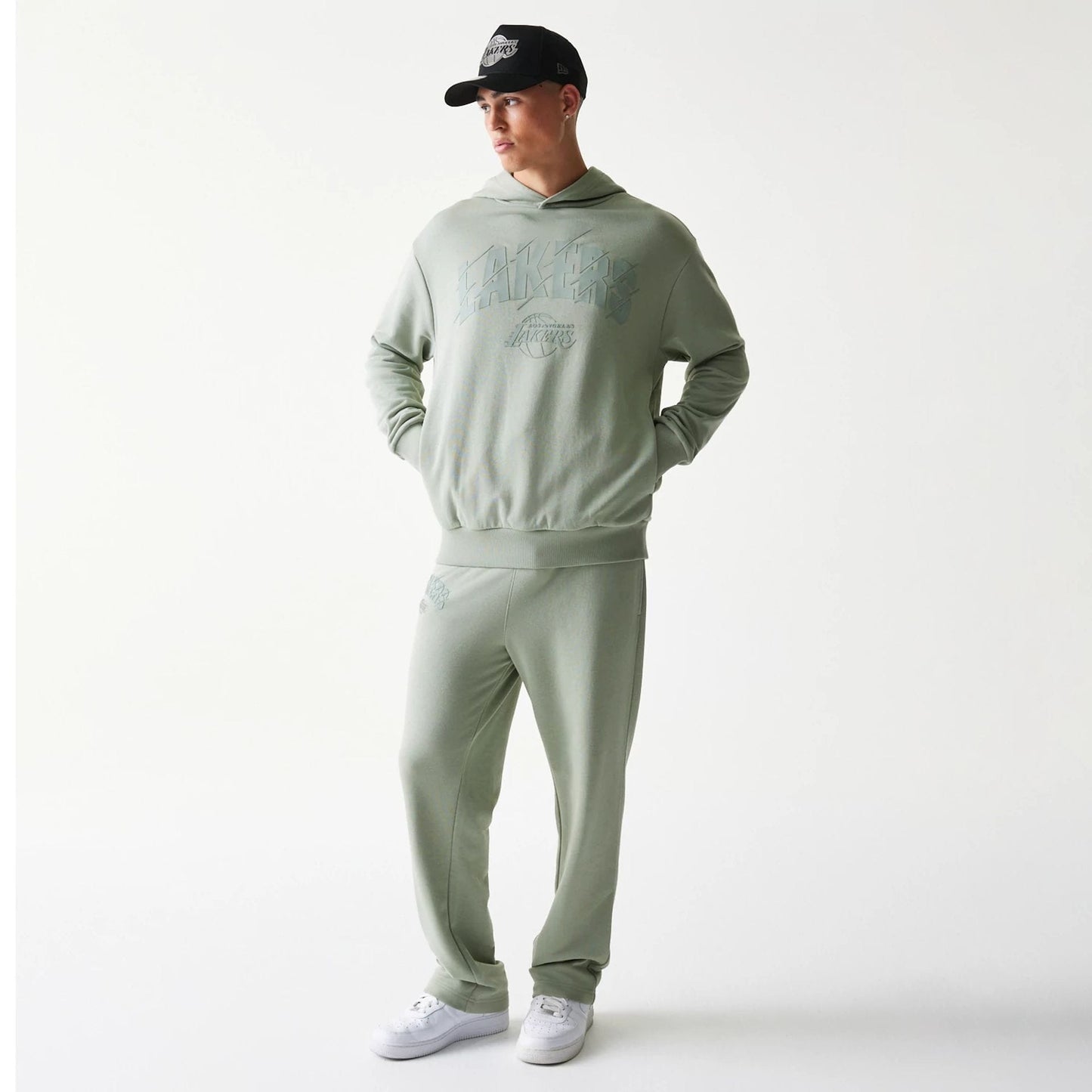 The model is wearing this NBA LA Lakers Oversized Pullover Hoodie in pastel green. 8