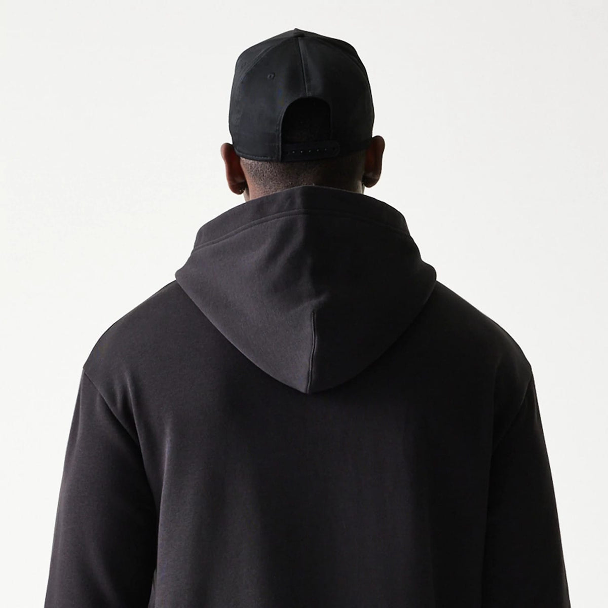 The model is wearing this NBA Chicago Bulls Oversized Pullover Hoodie in black. 8