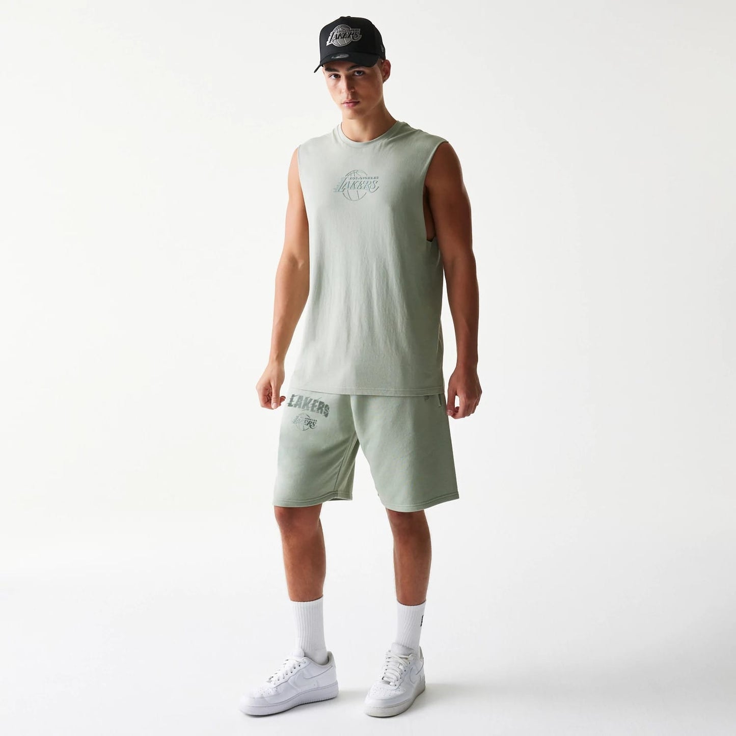 The model is wearing this NBA LA Lakers Shorts in pastel green. 8