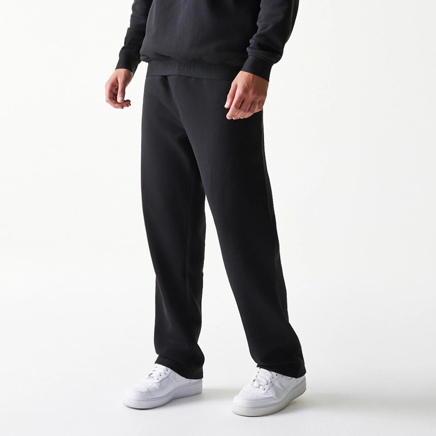 The model is wearing this New Era Tech Straight Leg Joggers in black on black. 3
