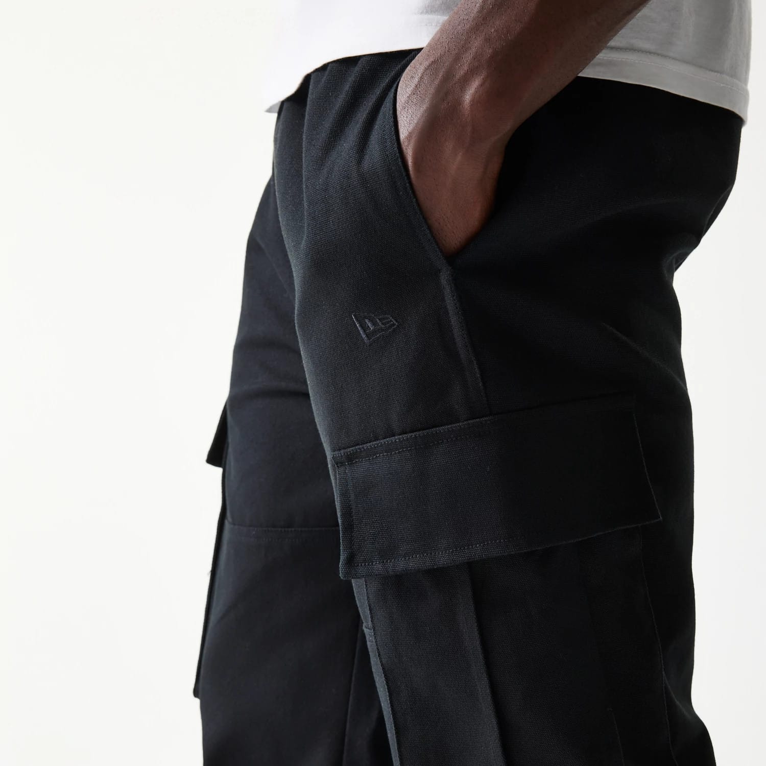 The model is wearing this New Era Straight Leg Cargo Joggers in black. 4