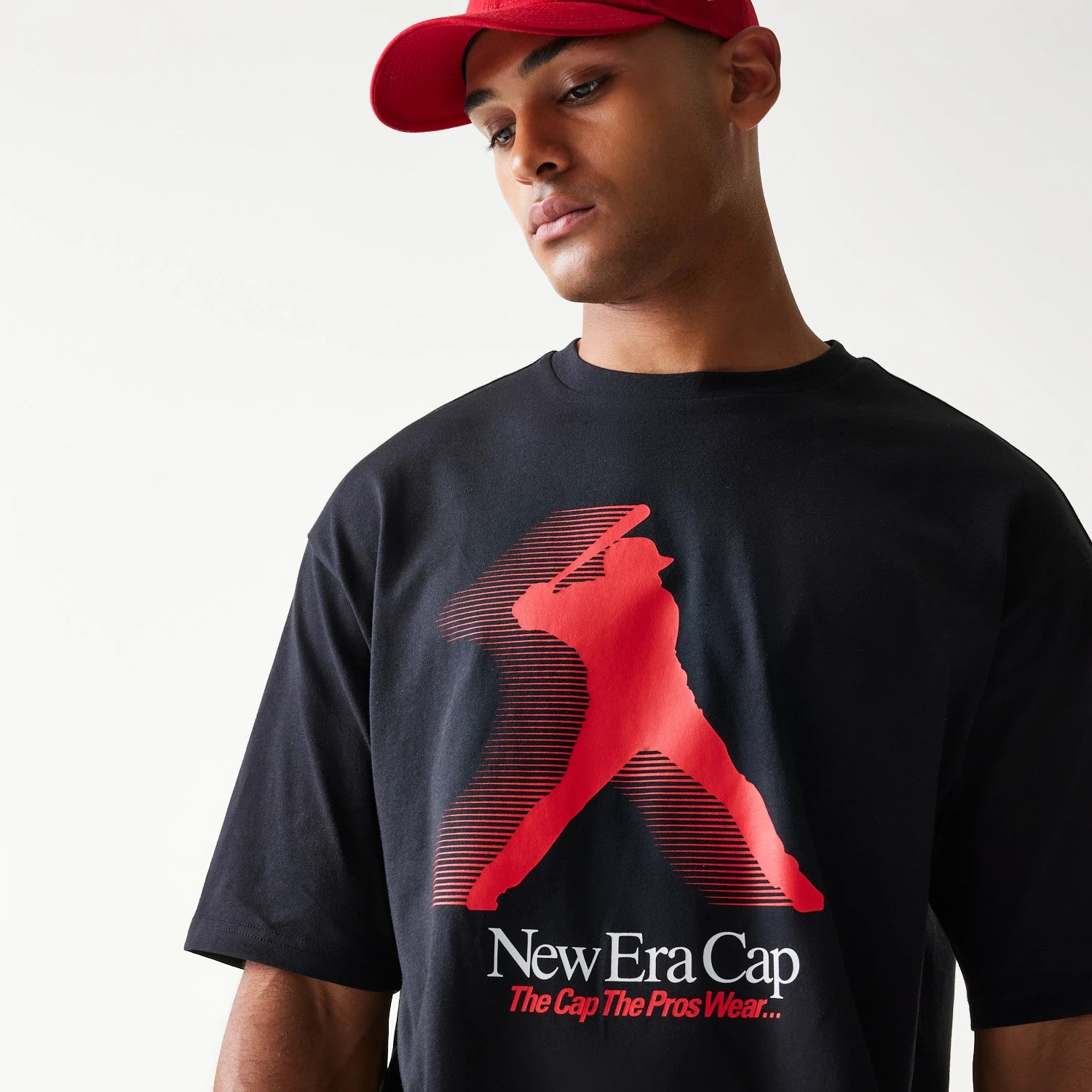 The model is wearing this New Era Baseball Player Graphic Oversized T-Shirt in black. 3