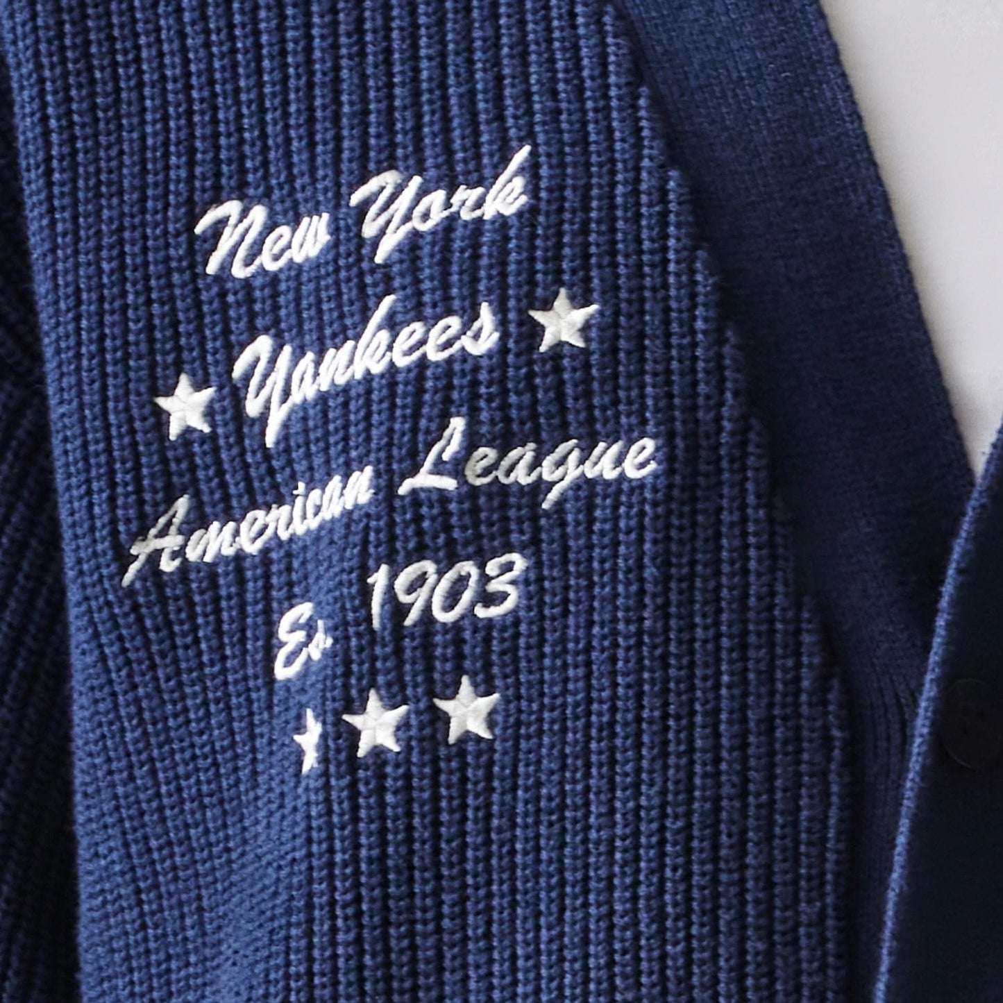 The model is wearing this MLB Collegiate New York Yankees Cardigan in navy. 8