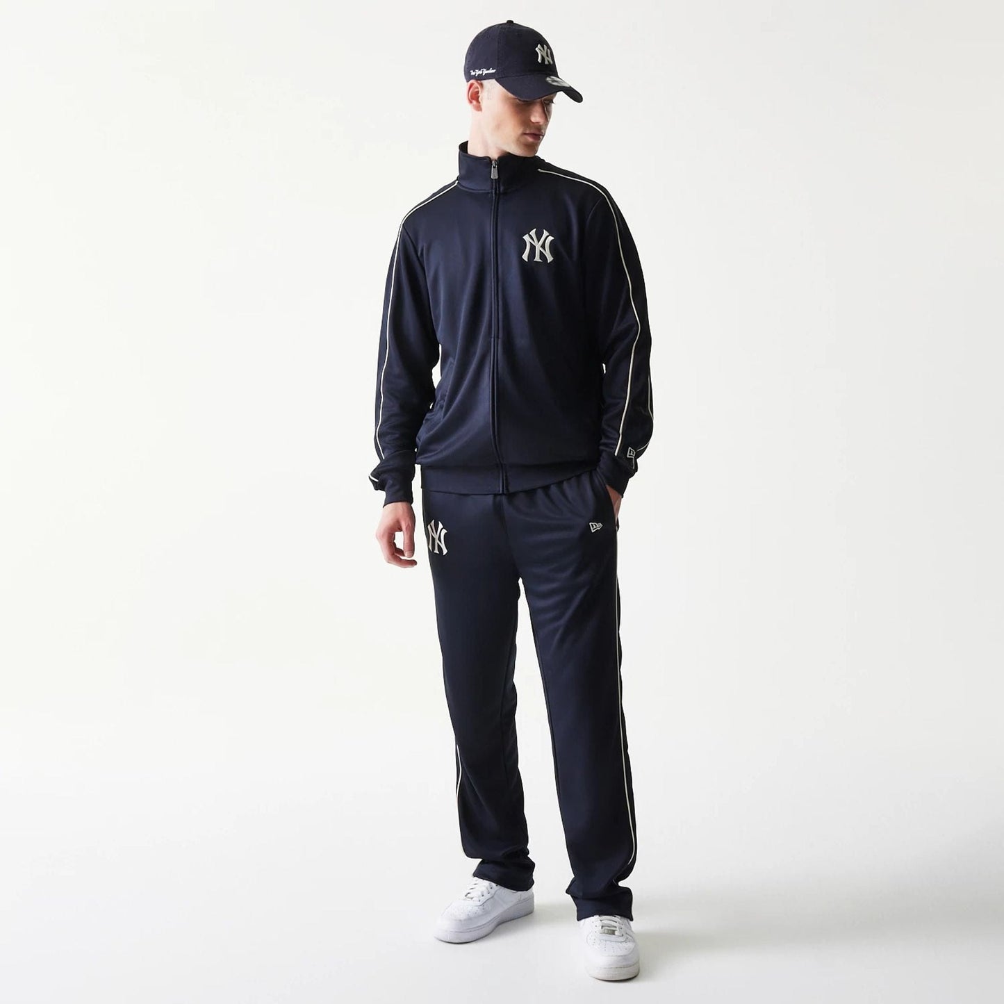 The model is wearing this MLB Piping New York Yankees Straight Leg Joggers in navy. 8