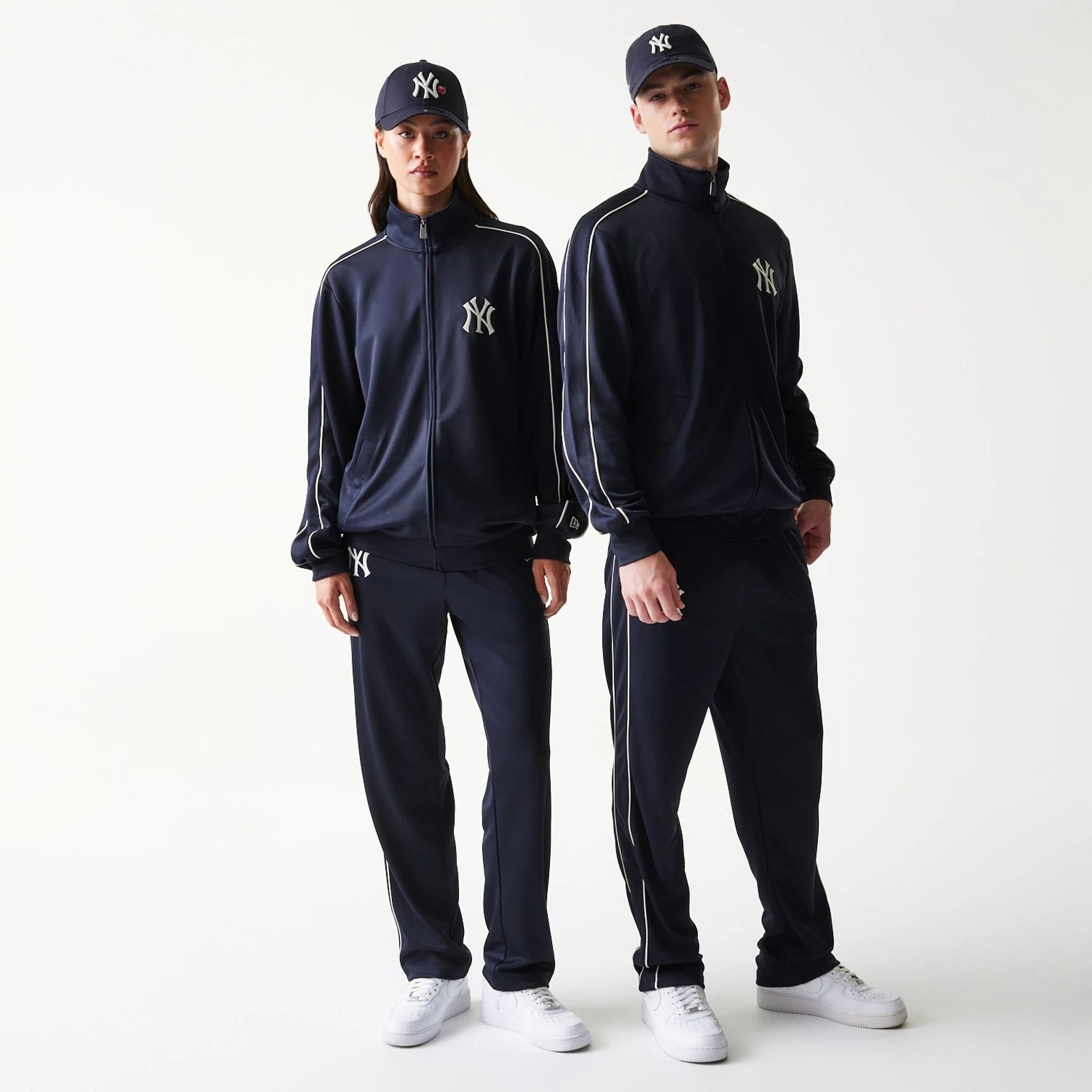The model is wearing this MLB Piping New York Yankees Track Jacket in navy. 1